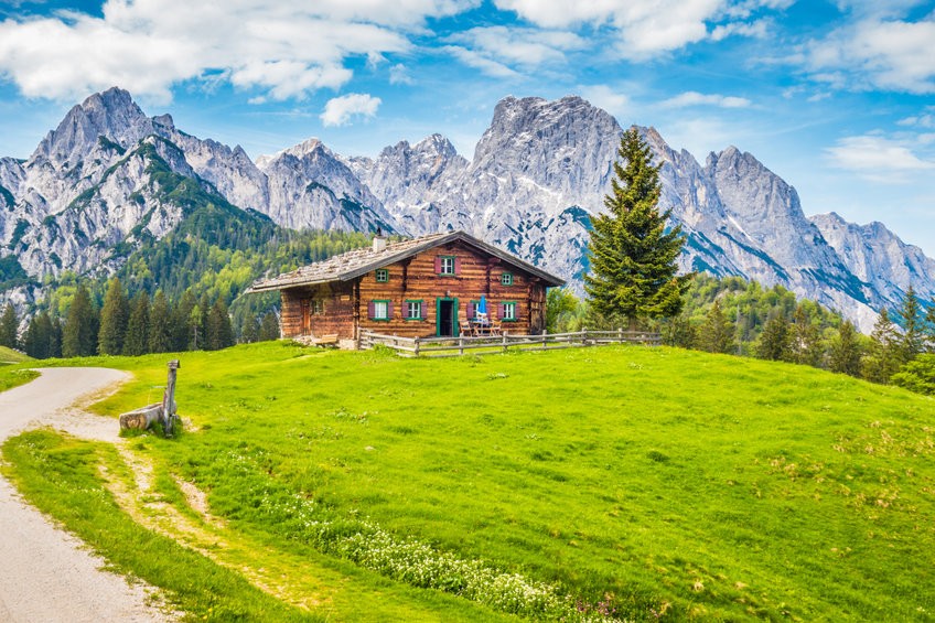 Idyllic mountain scenery in the Alps with traditional mountain c