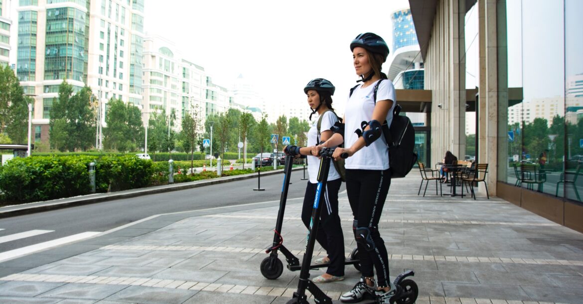 two women on electric scooters