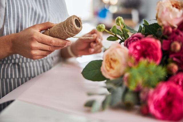 the florist makes a bouquet