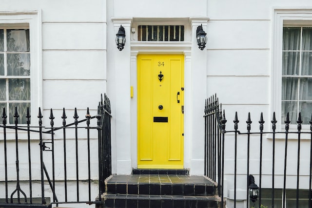 white house with yellow door