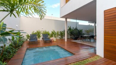 a-pair-of-black-lounge-chairs-near-jacuzzi