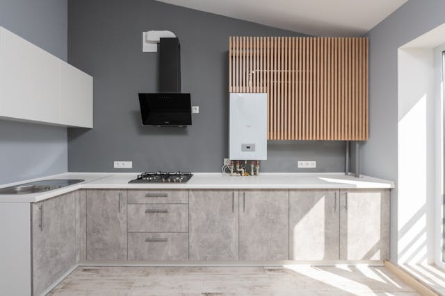 white-counter-top-on-gray-kitchen-cabinets