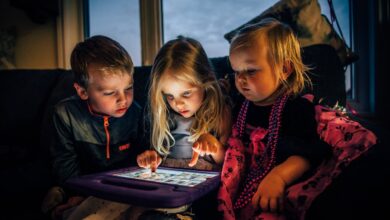 three-children-looking-at-a-tablet-computer
